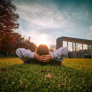 Ursinus student on grass, open campus